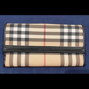 Authentic Burberry wallet.  Used, normal wear.